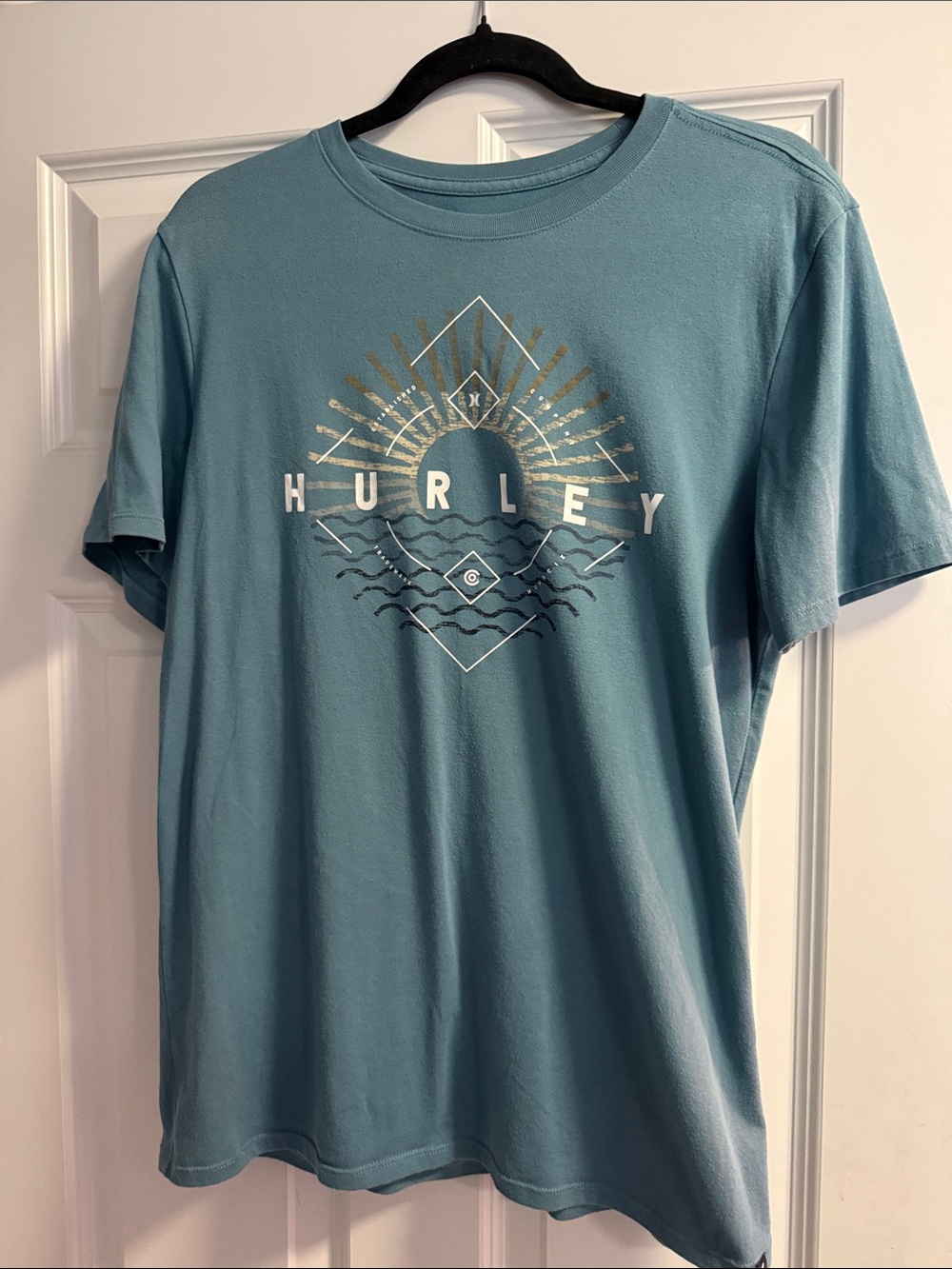 Hurley Teal Graphic Tee with Gold Sunburst